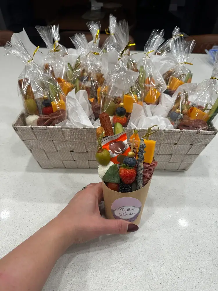 Charcuterie individual cup with cheese cubes, cured meat, crackers, and fruit for single servings Papillon Charcuterie grazing cup with assorted snacks, perfect for events in Hamilton Elegant individual charcuterie cup for weddings, parties, and corporate catering